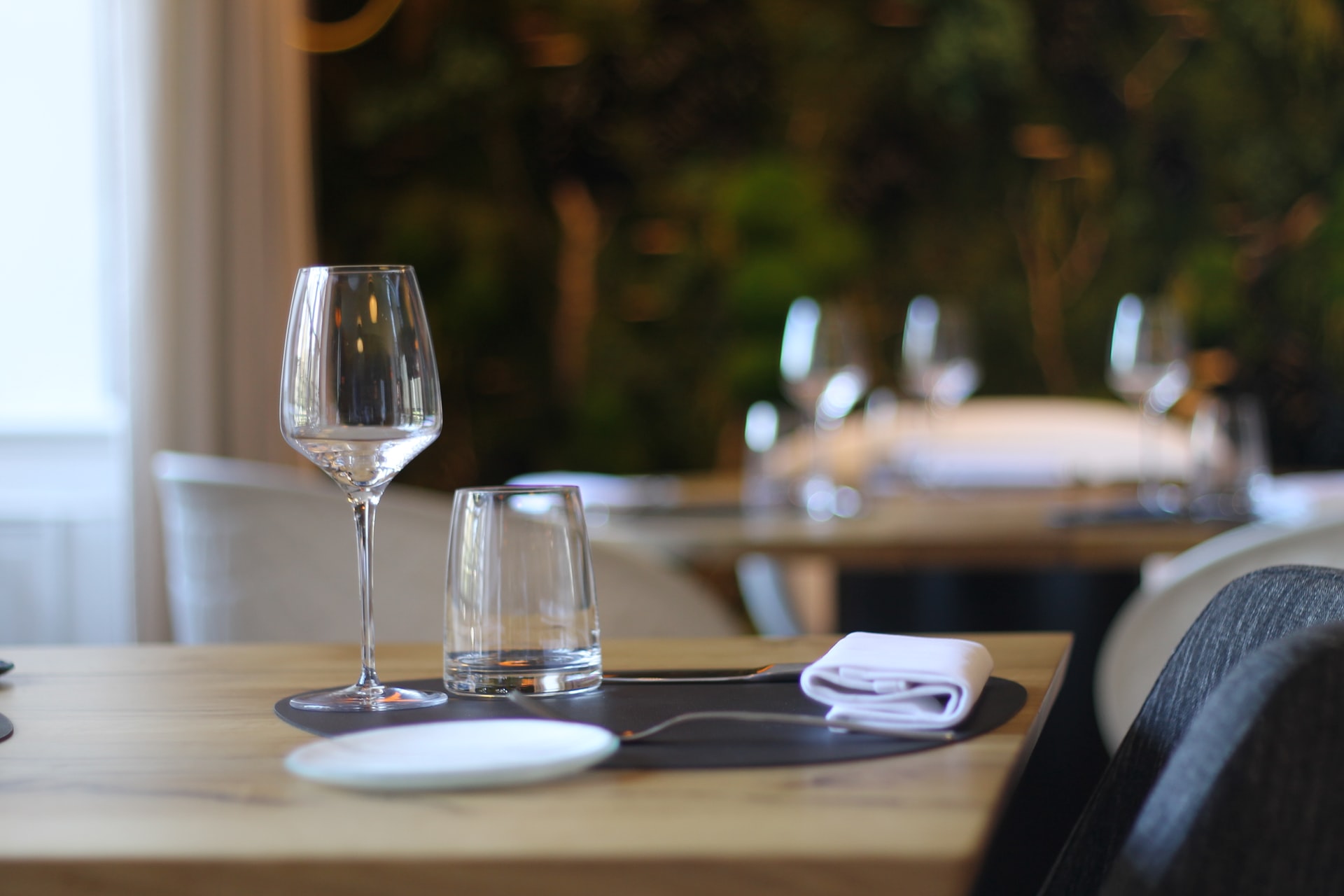 wine glass on a table with napkin